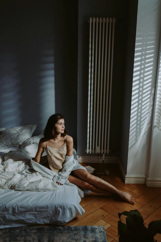 a young woman laying on the bed while smiling