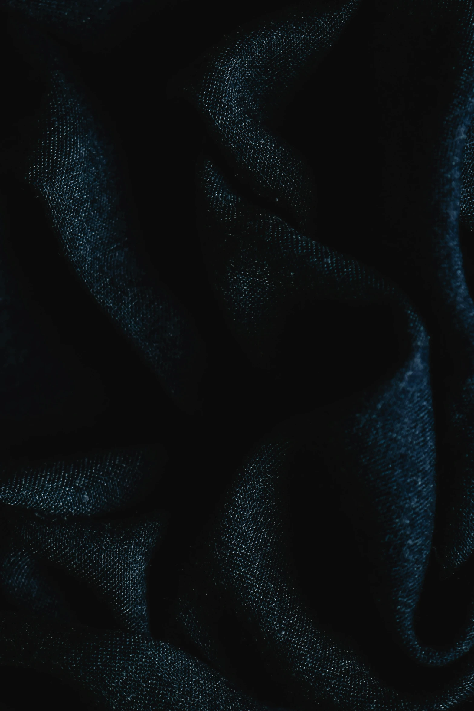 a black fabric with some folds or folds
