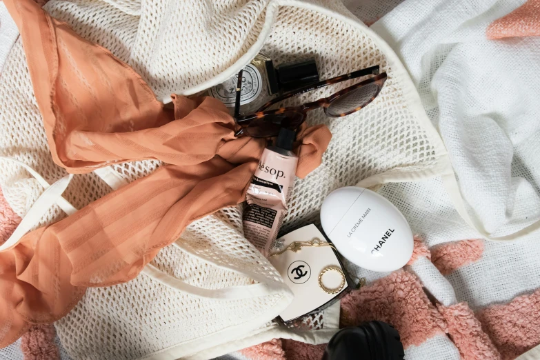 various items displayed on a blanket that's neatly folded