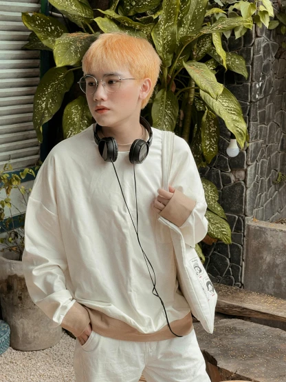 a person with orange hair wearing headphones