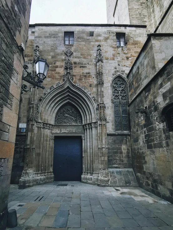 an old church with blue door and windows in an empty square