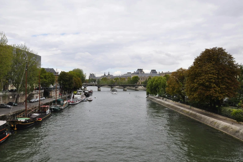 a river with several canoes parked along it