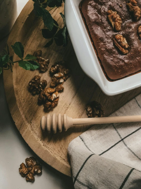 a bowl of nutritious looking ding is next to a spoon