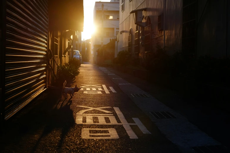 a street with a sign saying hong in a foreign language on the road