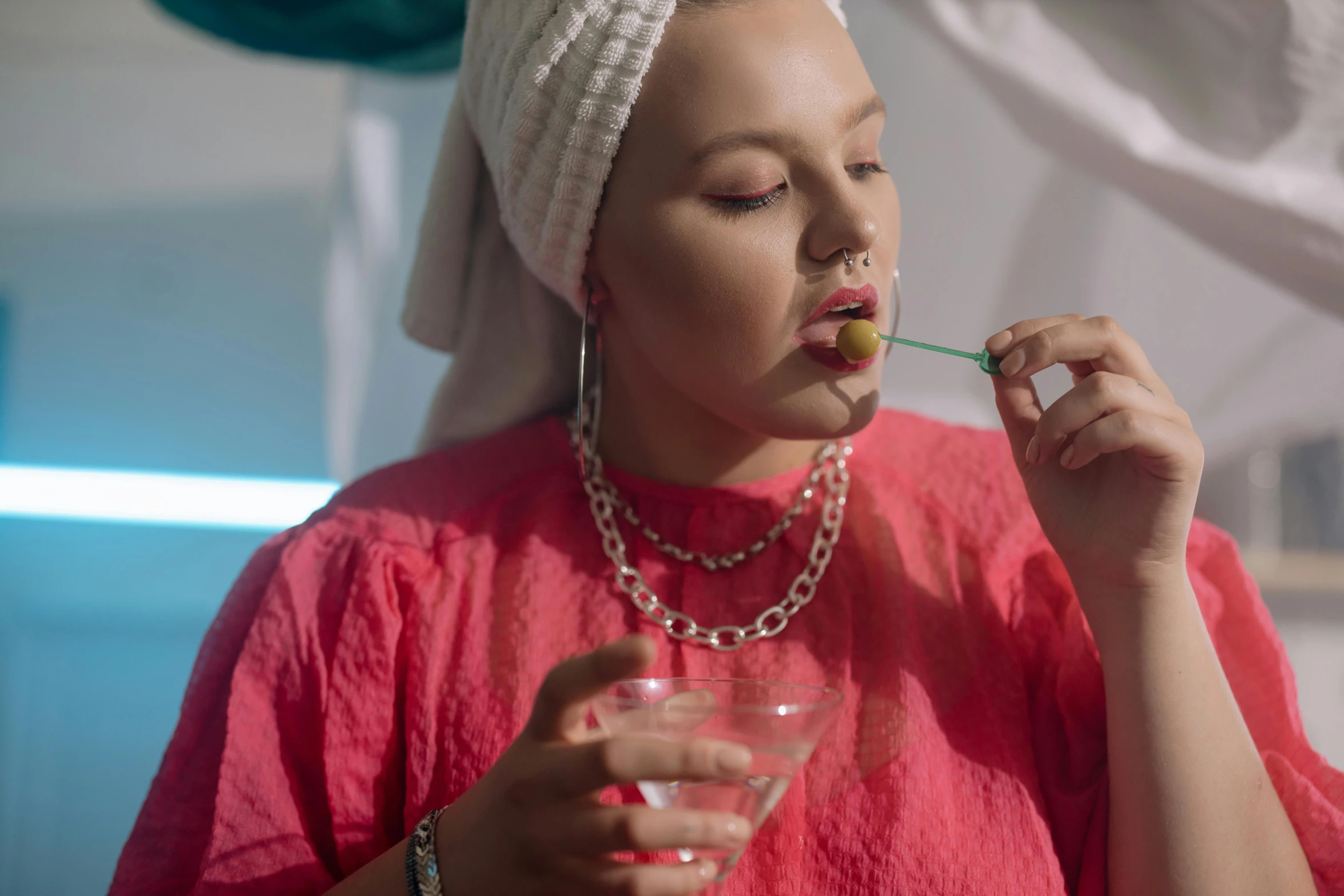 a young woman with a straw in her mouth