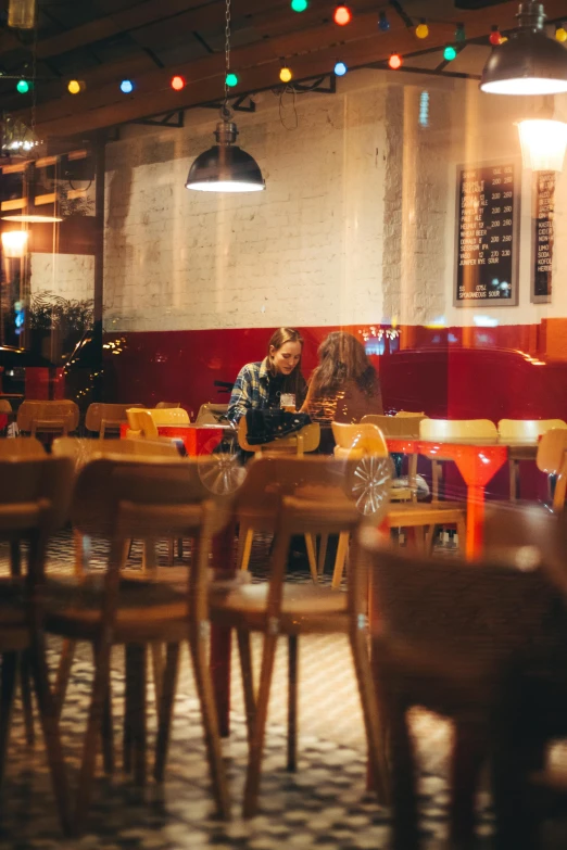 a po taken through a large window at a restaurant