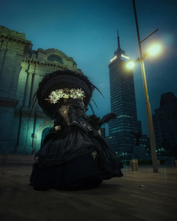 a woman in costume with dark clothes on a city street