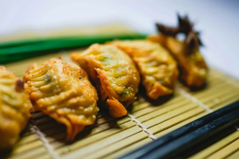 several vegetables and meat on top of a bamboo tray