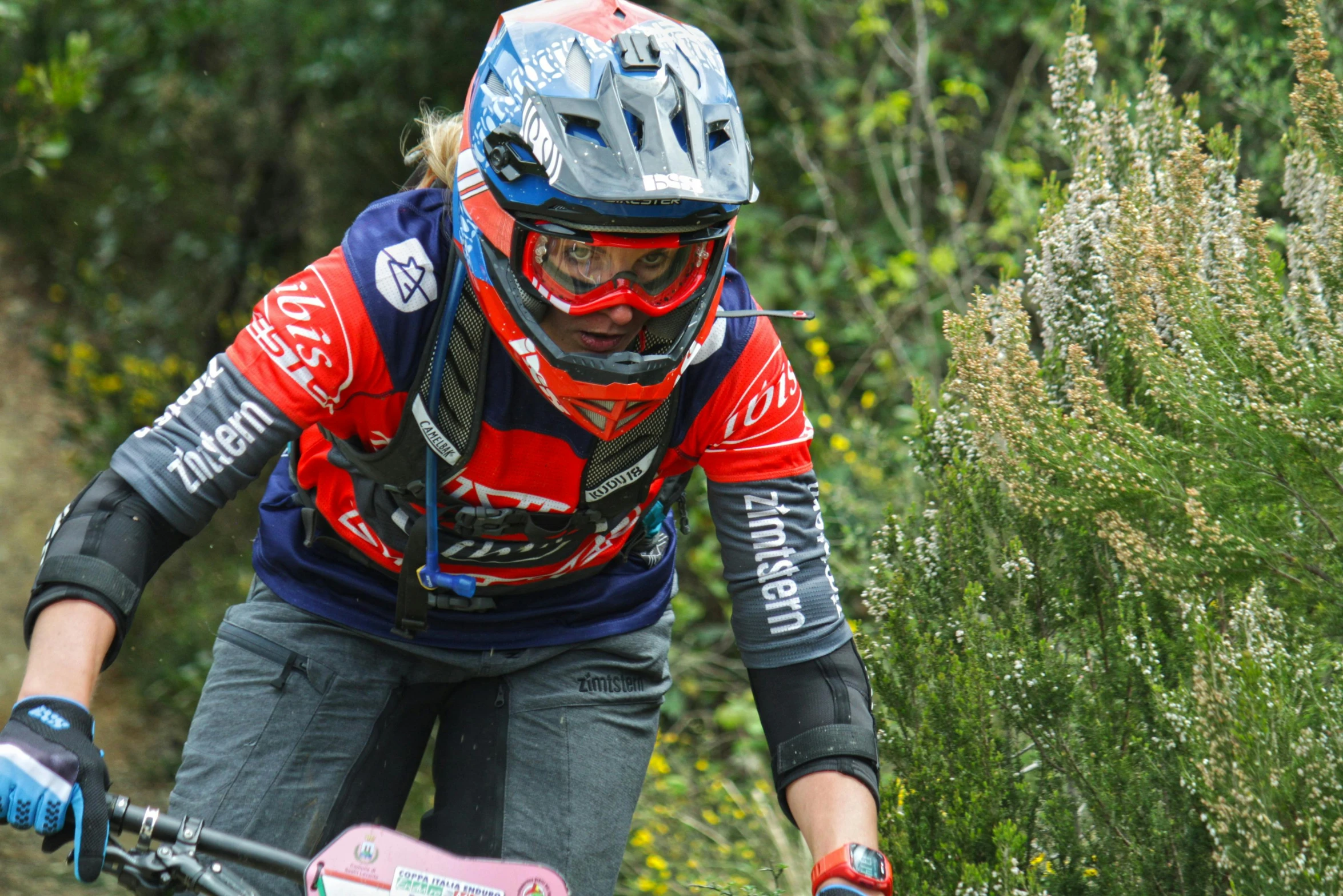 a man riding on top of a dirt bike