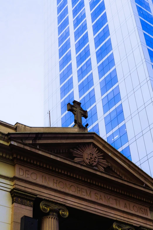 an old building with a statue on the top