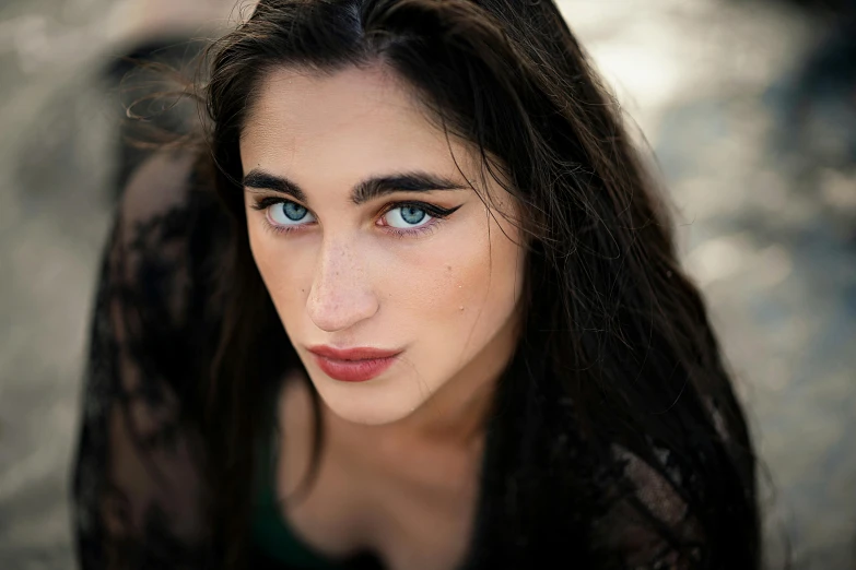 a woman posing with her hair in the wind