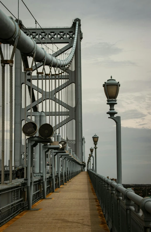 walkway that stretches across the top of a bridge in grey