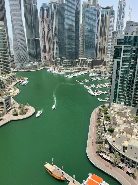 an aerial view of boats on the water in a harbor