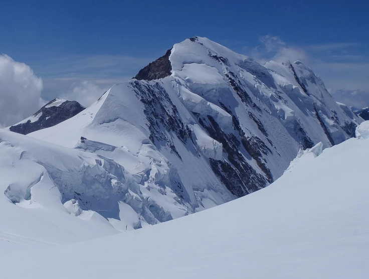 some people on skis going down a mountain