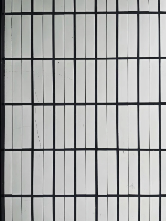 abstract white wall tiles and grid pattern arranged in diagonal rows