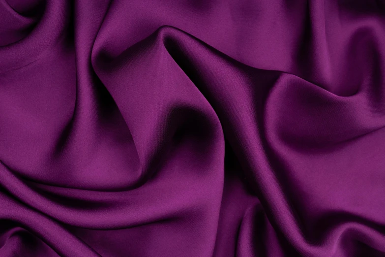 a purple satin background with very soft folds