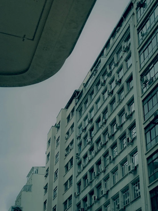 a tall building with lots of windows in front of it