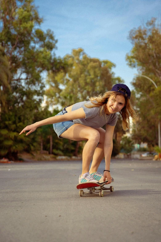 the girl is riding on her skateboard outside