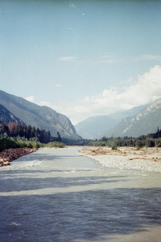 an image of a river flowing in the mountains