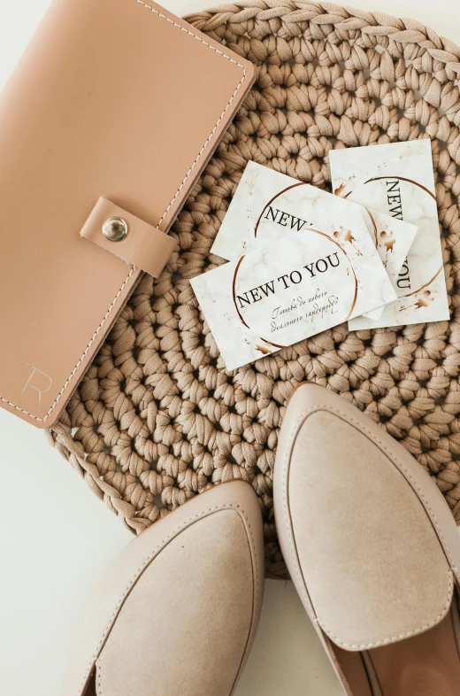 shoes and wallet sitting next to each other on the floor