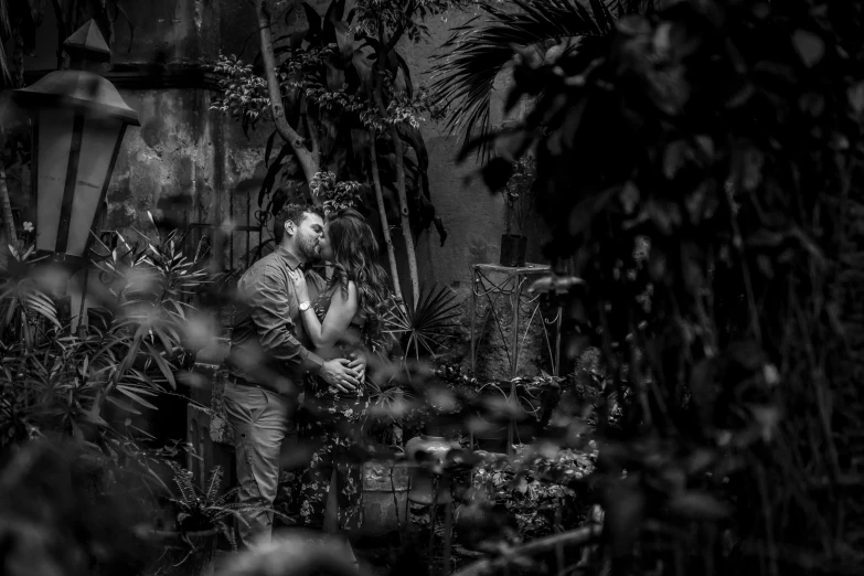 a black and white pograph of a man in a garden