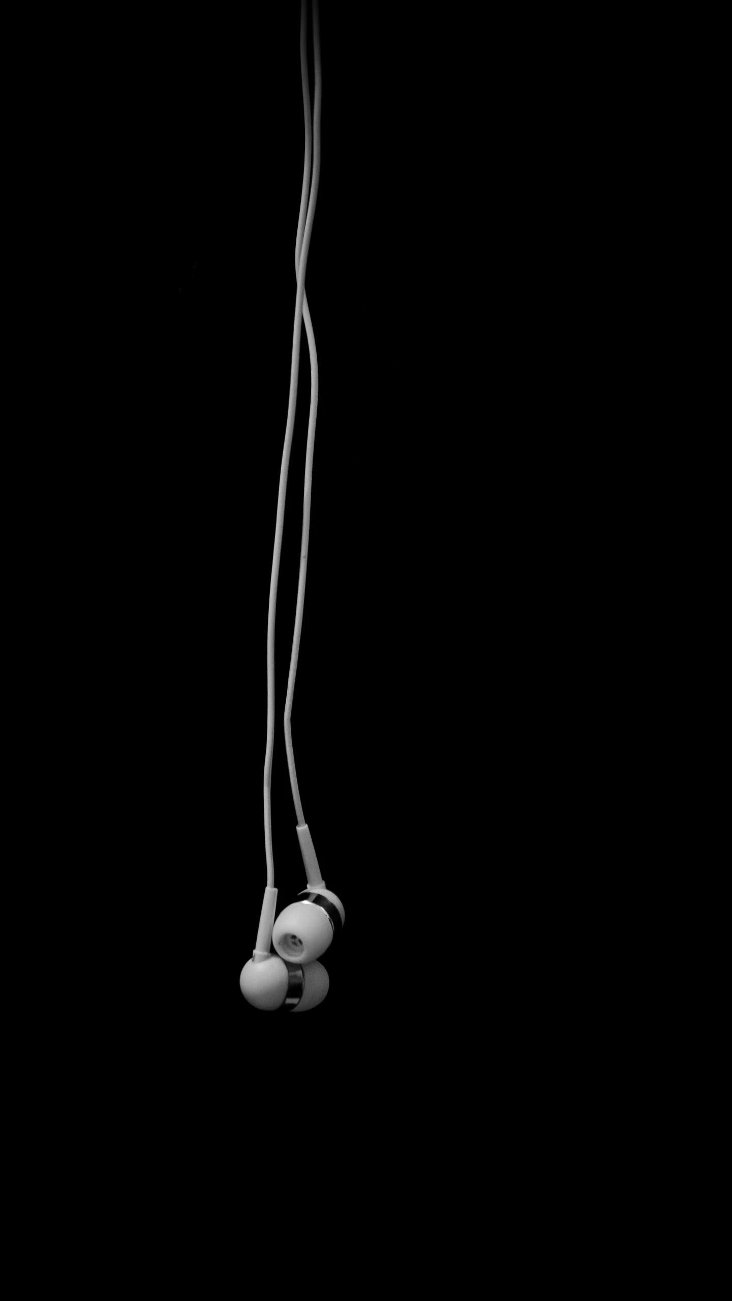 a black and white po of a ball and some string