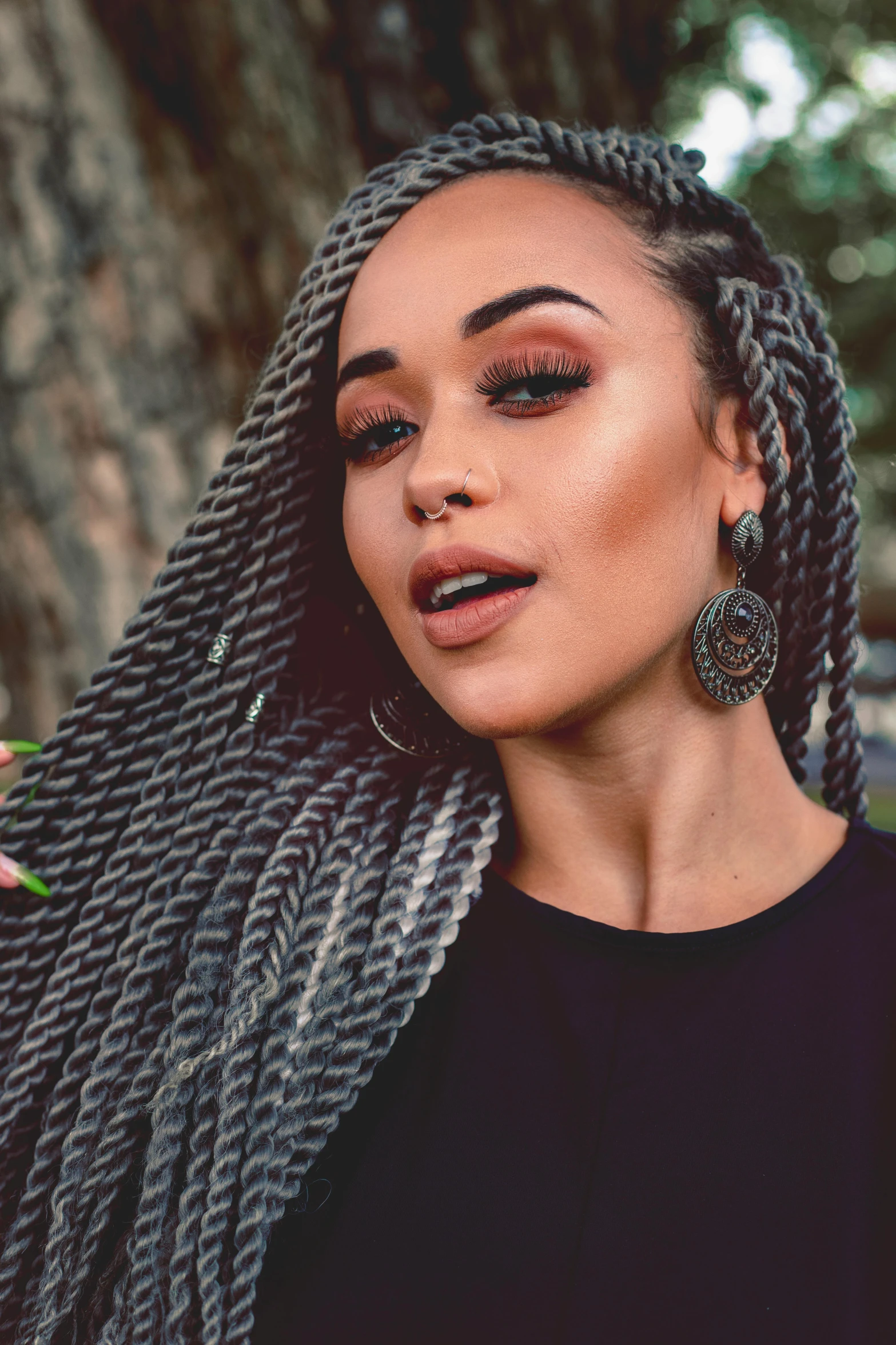 a woman with ids wearing earrings on her ear