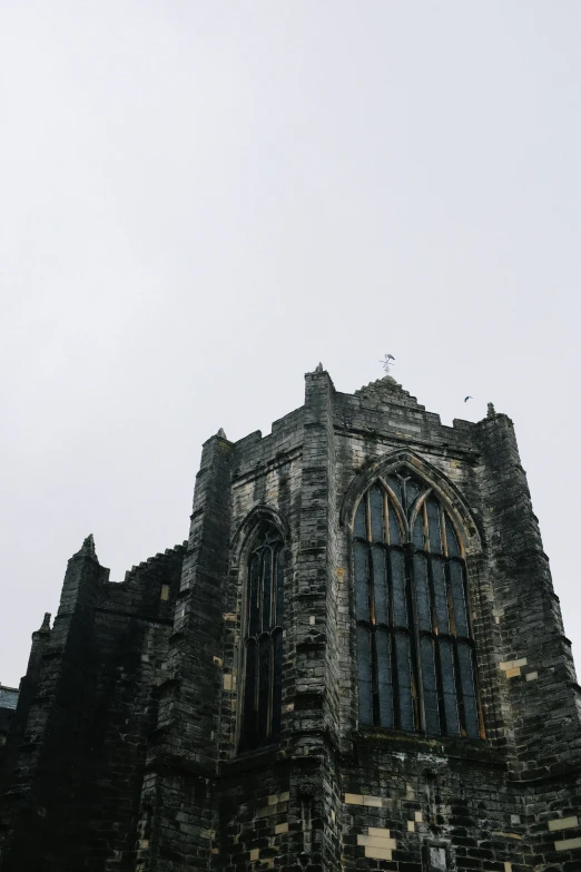 the top of an old building with an arch in it