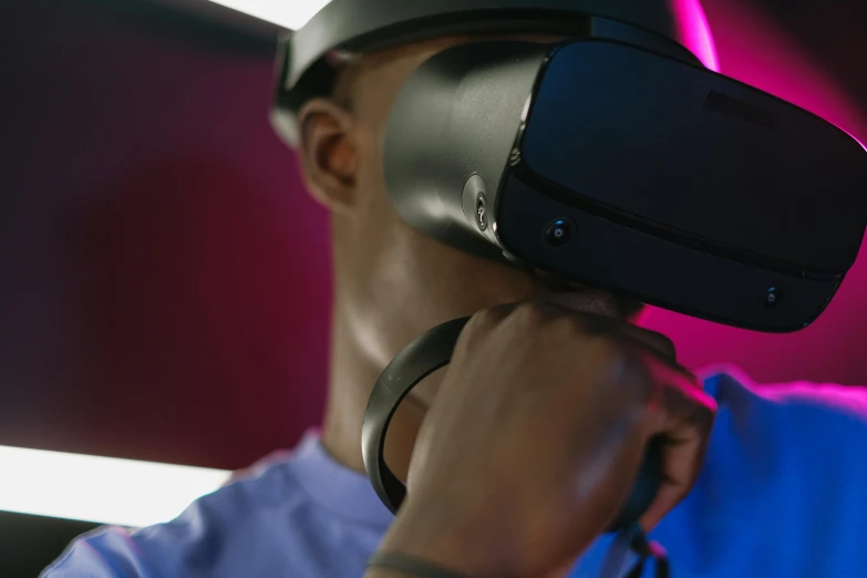 a man holding a camera on top of his head