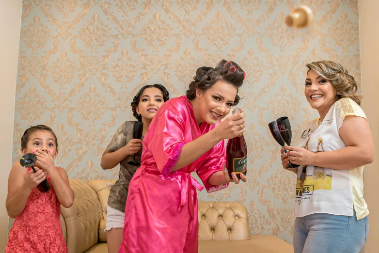 a group of woman are playing in a room with many things