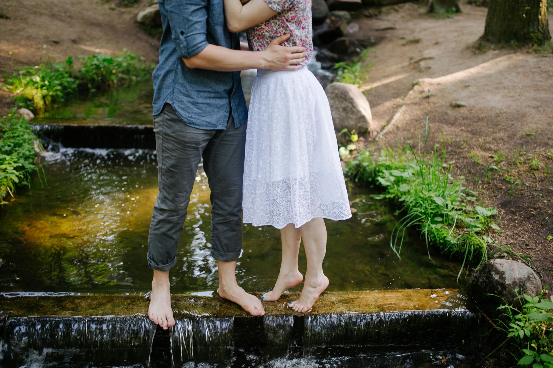 a couple in love kissing and posing for the camera