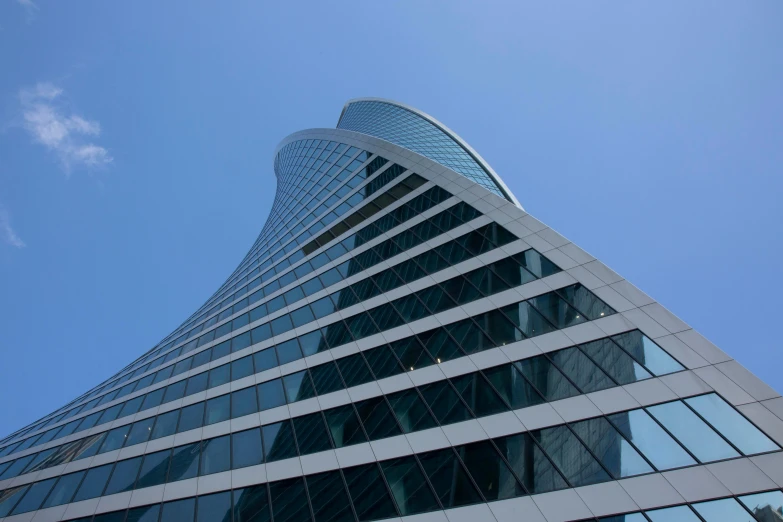 the upward view of the corner of a large building