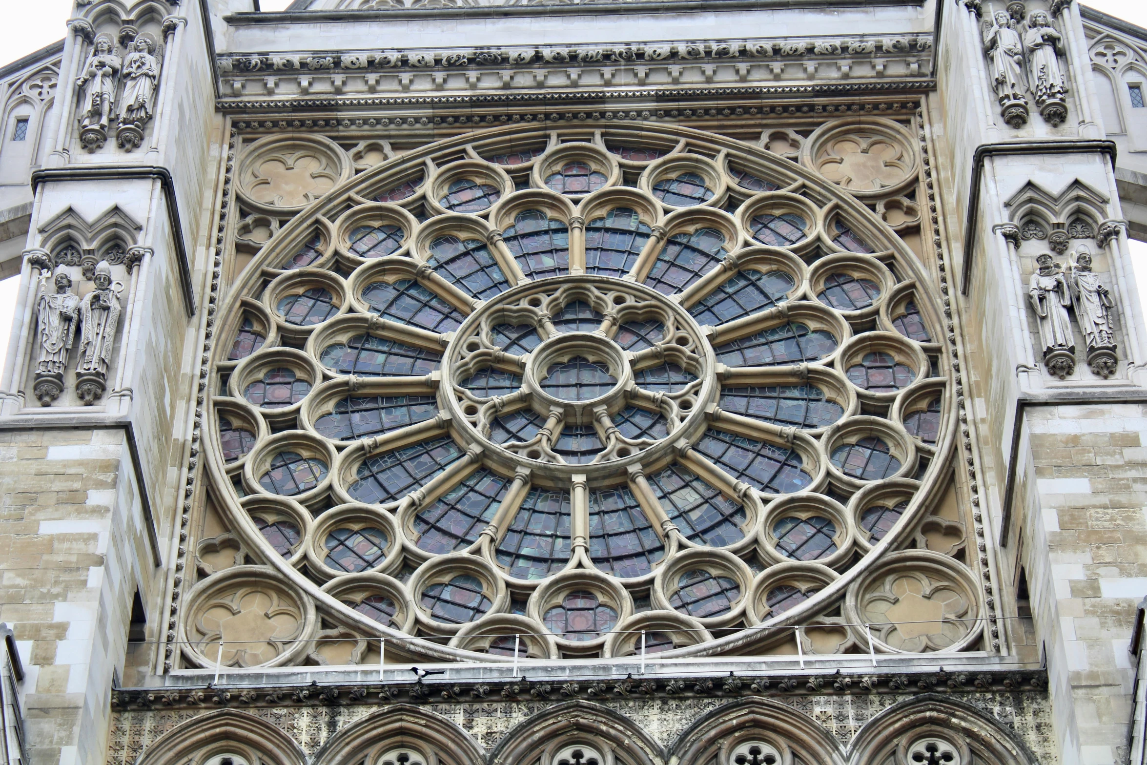 a large ornate window on the outside of a building