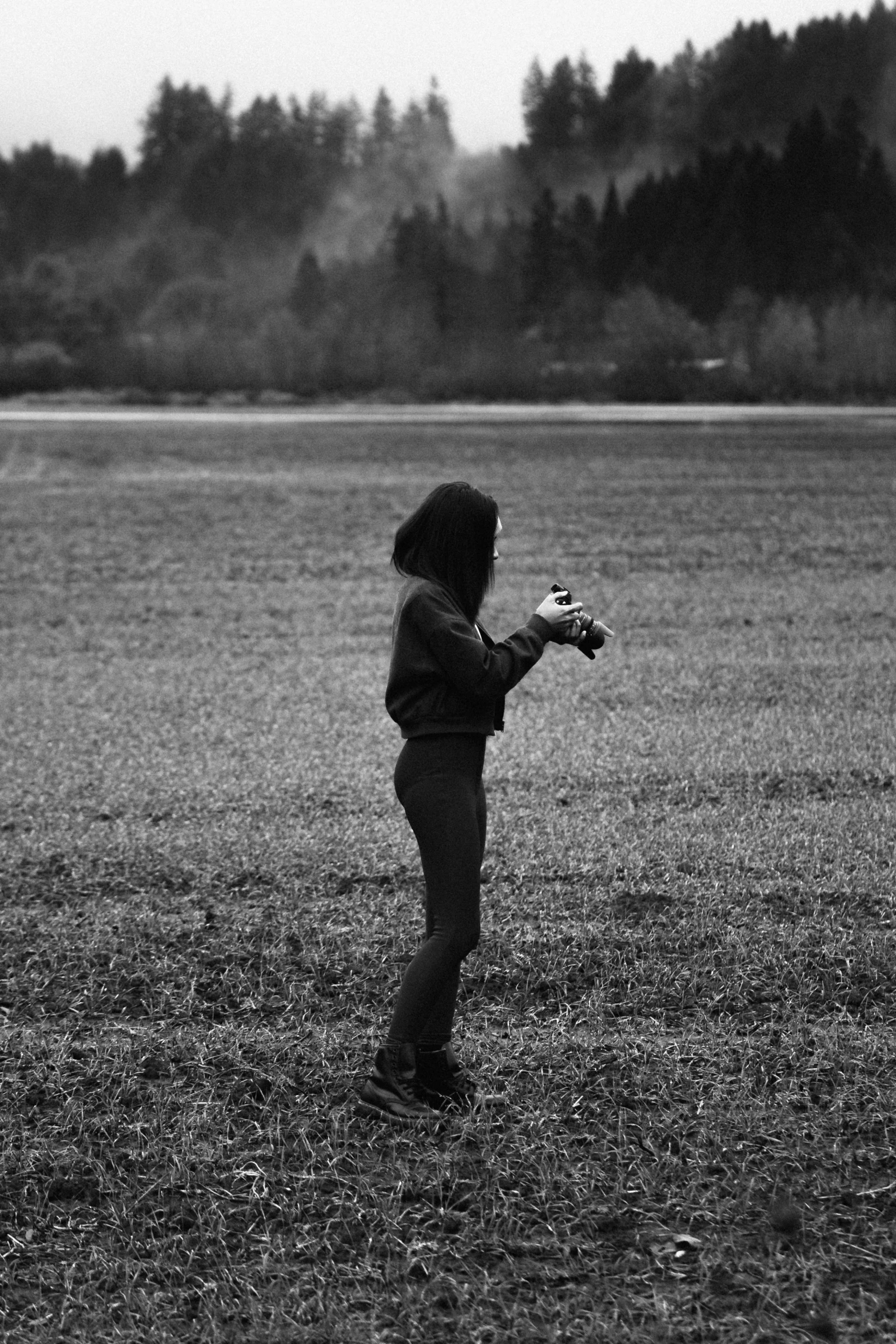 a young child standing on top of a grass field