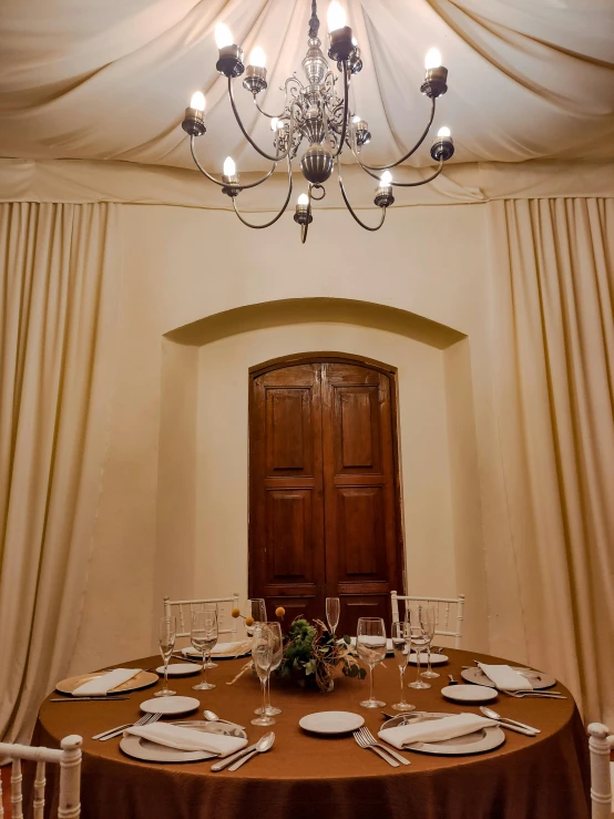 a fancy dining table in a white formal room