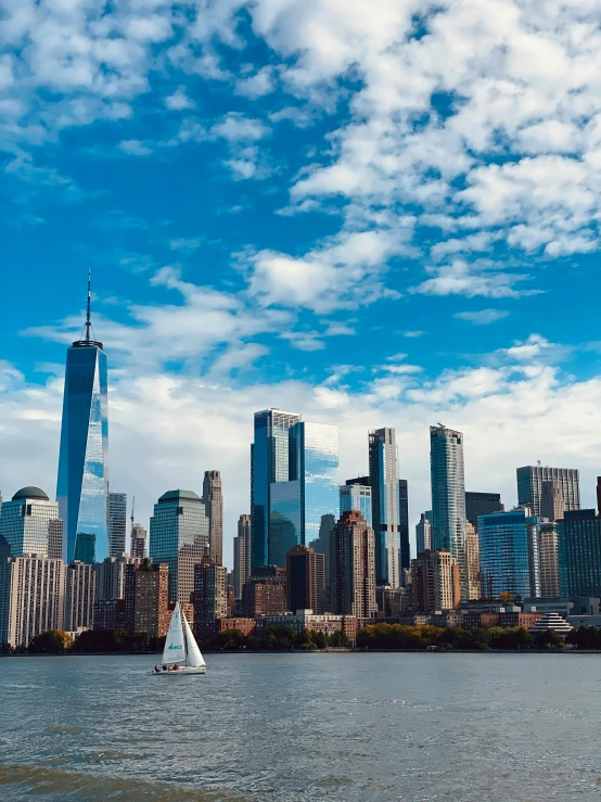 the skyline of the city with skyscrs and boats on the water