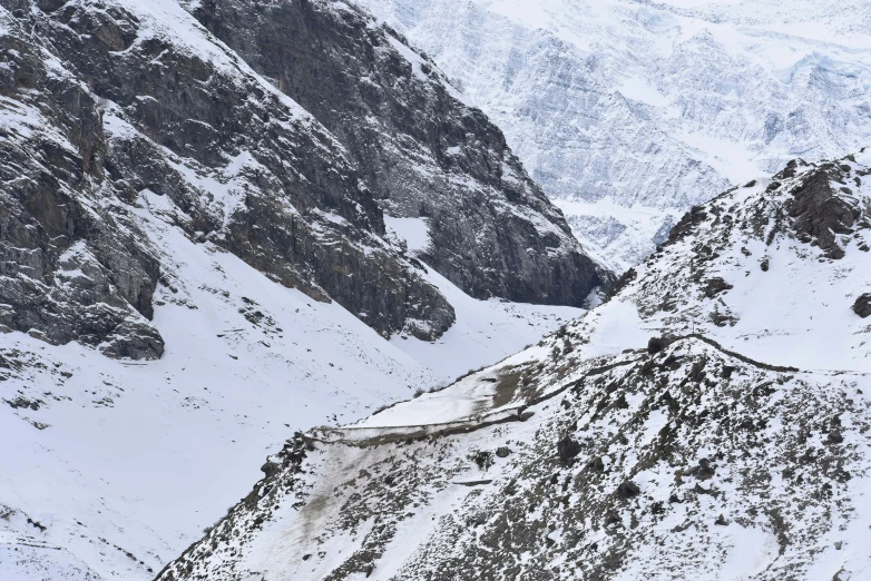 the top of some very big mountains covered in snow