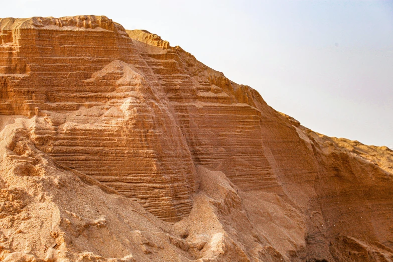 the brown rocks look like they have been carved into soing