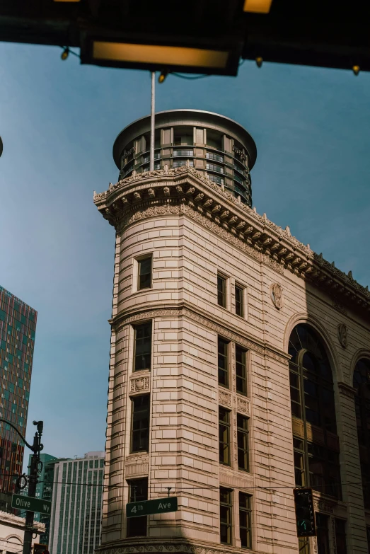 a very tall clock tower standing above a city street