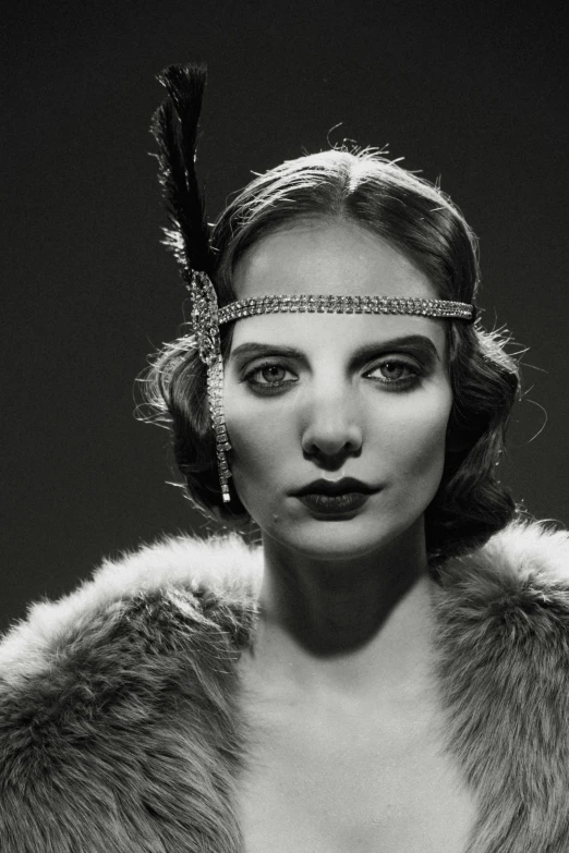 a woman wearing a feather headband with feathers