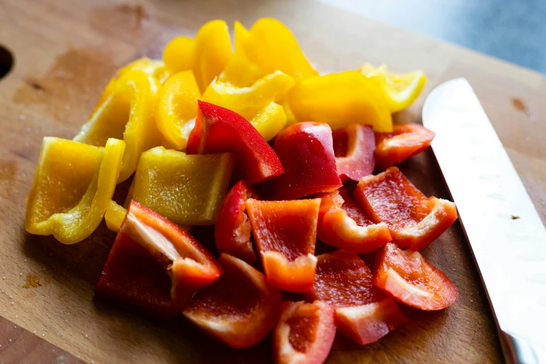 a knife sitting on top of sliced up fruit