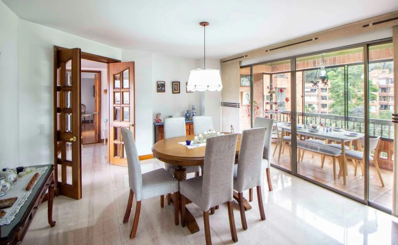 an open kitchen and dining room with large glass doors