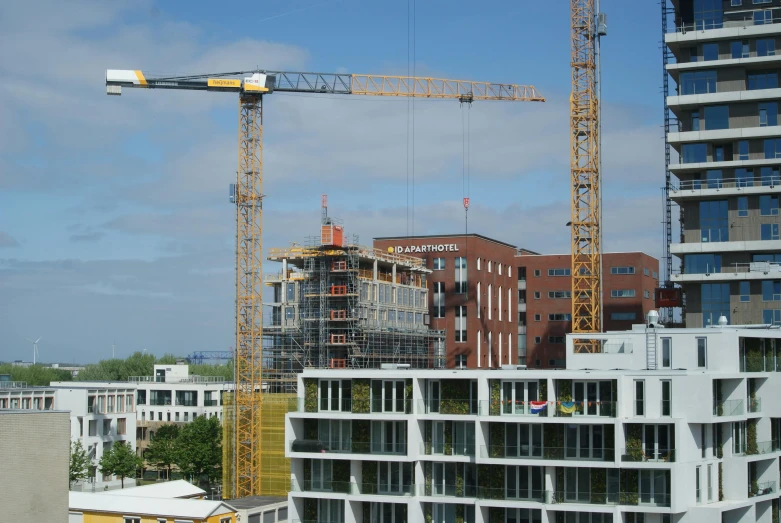 a crane is next to a building under construction