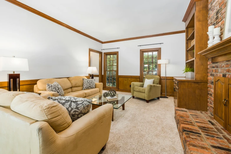 a room with furniture in it, and a fireplace