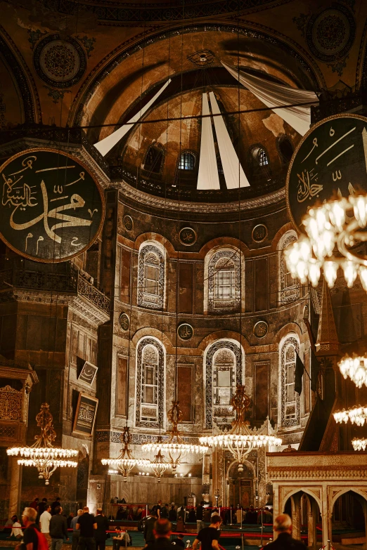 the inside of a large ornate building with chandeliers