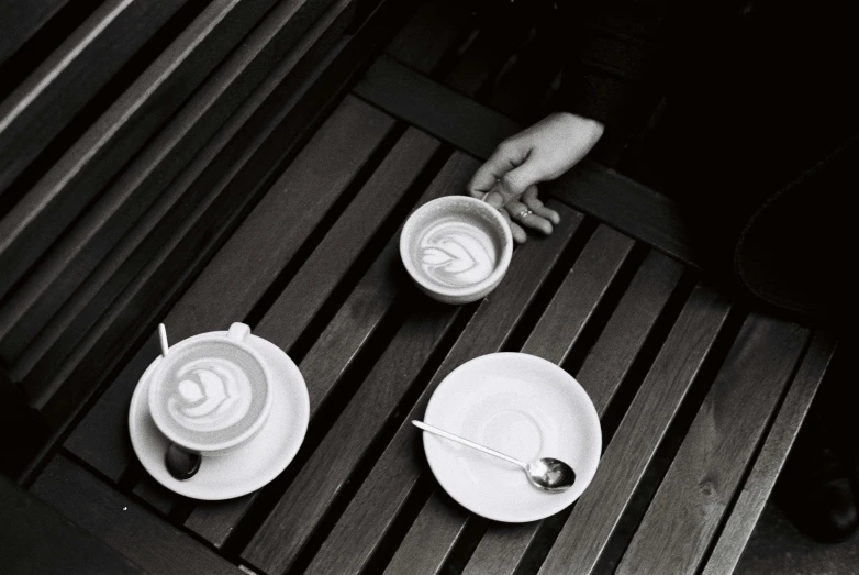 a black and white po of coffee cups with handles