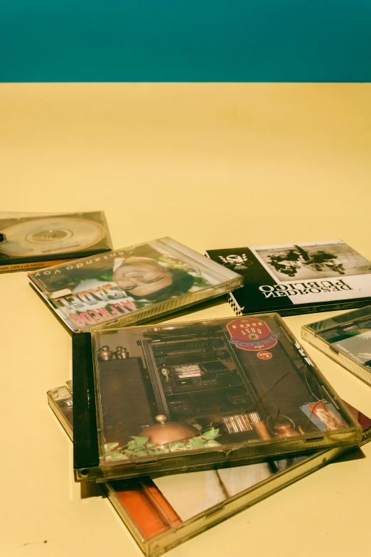 cd cases are shown on a counter top with a yellow floor