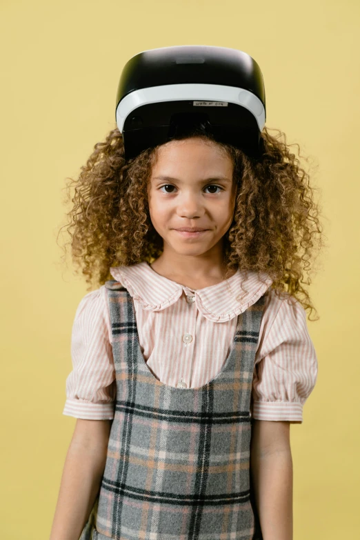  with hair standing and looking at camera, in short dress with helmet on top