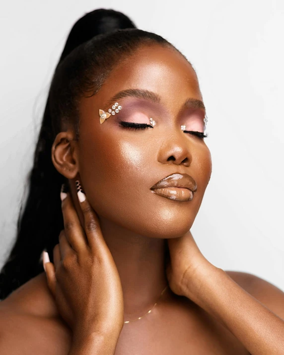 a woman with makeup on and under her chin, posing for the camera