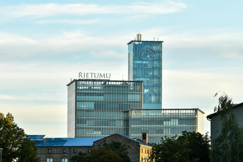 a clock on top of a tall building in a city